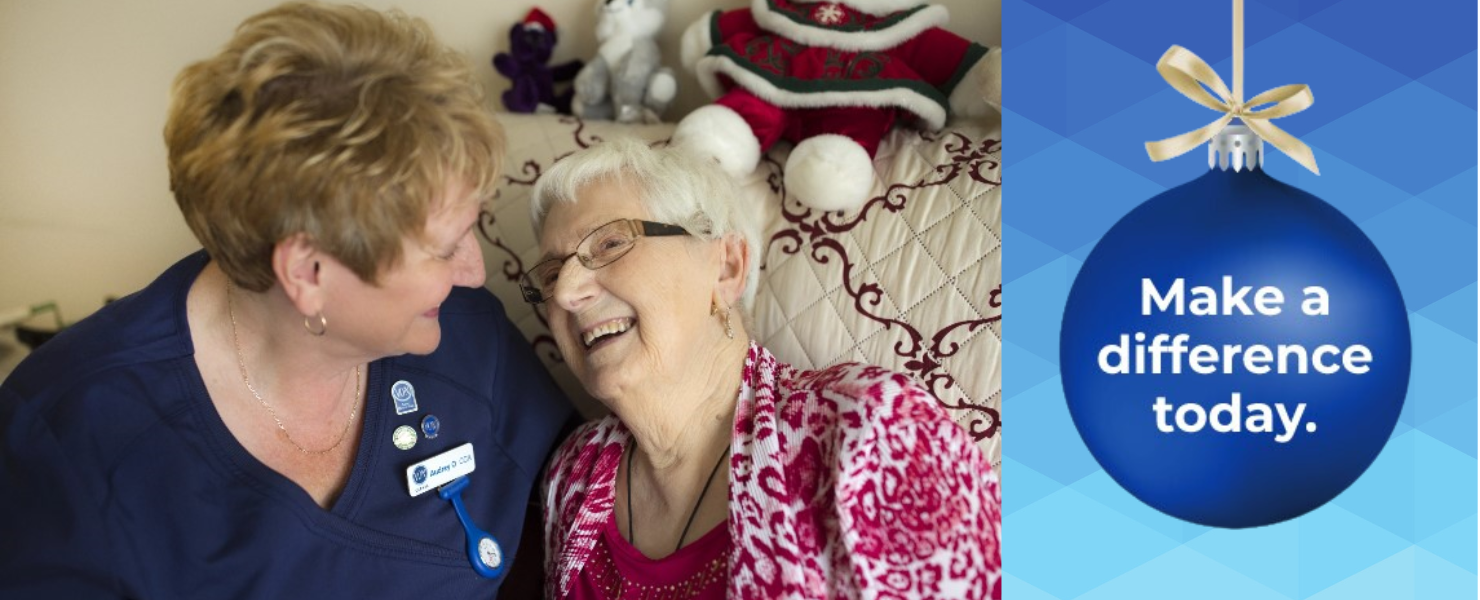 Christmas ornament text "Make a difference today" with VON staff and client looking at each other. 